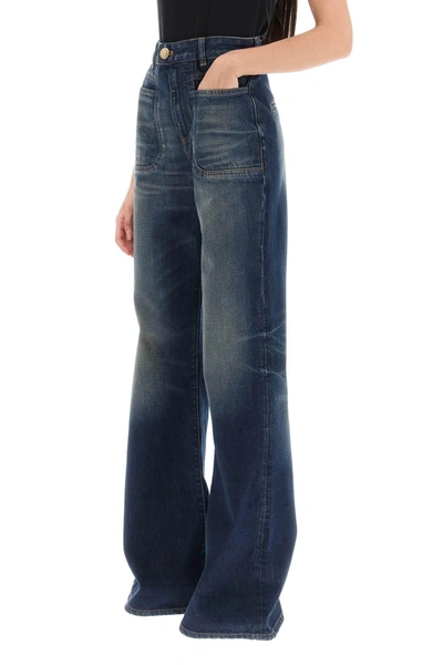 Shop Balmain Wide Leg Jeans With Dark Wash