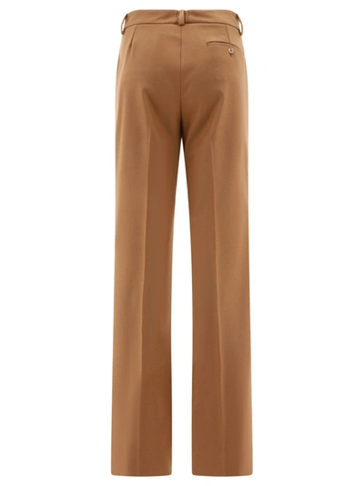 Shop Dolce & Gabbana Wool Trousers With Plaque