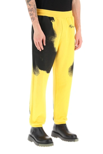Shop Moschino Graphic Print Jogger Pants With Logo