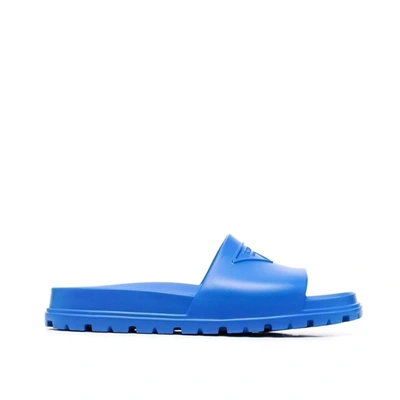 Prada Embossed-logo Open-toe Slides In Blue