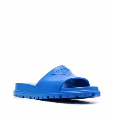 Prada Embossed-logo Open-toe Slides In Blue