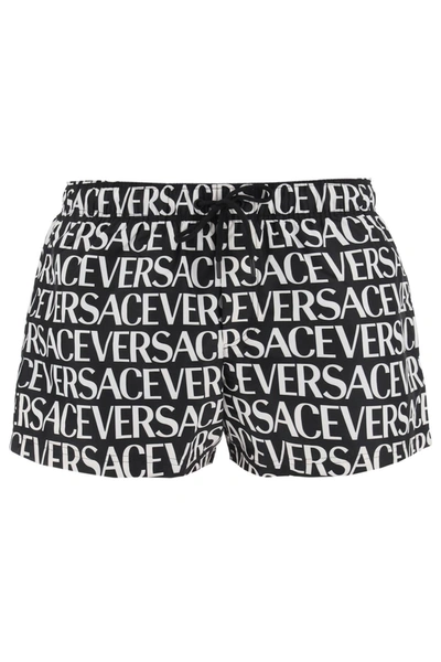 Shop Versace Allover Swim Trunks