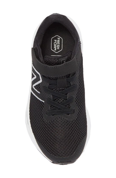 Shop New Balance Kids' Ari Sneaker In Black