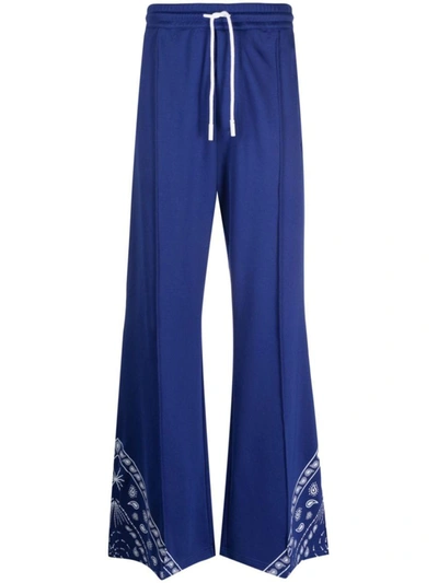 Shop Marcelo Burlon County Of Milan Trousers In Blue