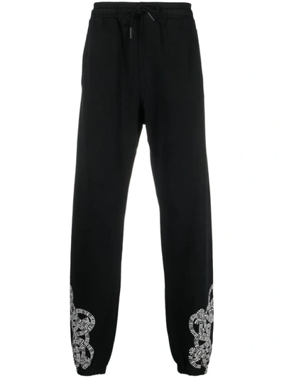 Shop Marcelo Burlon County Of Milan Trousers In Black Whit