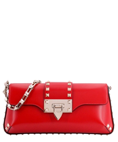 Shop Valentino Small Rockstud Flap Leather Clutch In Red