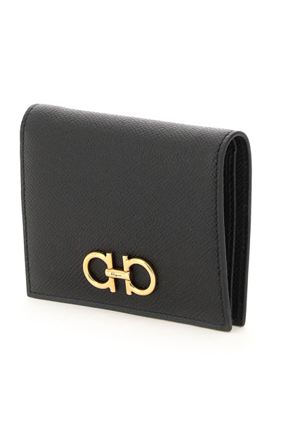 Shop Ferragamo Gancini Bifold Wallet In Black