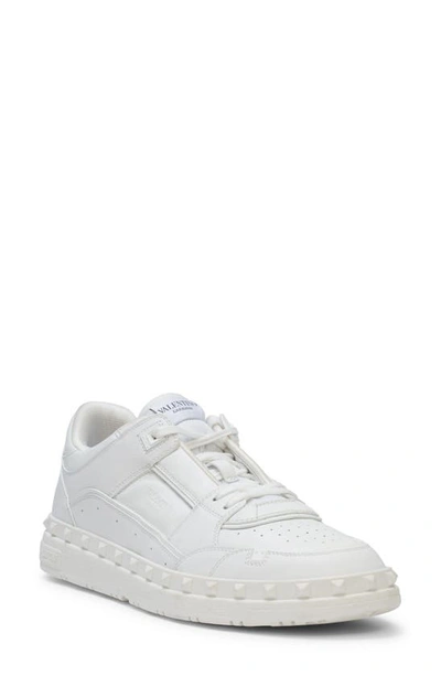 Shop Valentino Rockstud Low Top Sneaker In Obo Bianco/bianco