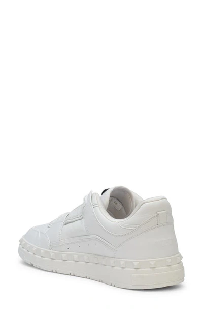 Shop Valentino Rockstud Low Top Sneaker In Obo Bianco/bianco