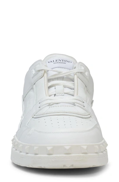 Shop Valentino Rockstud Low Top Sneaker In Obo Bianco/bianco