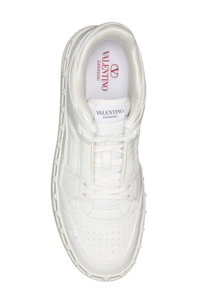 Shop Valentino Rockstud Low Top Sneaker In Obo Bianco/bianco