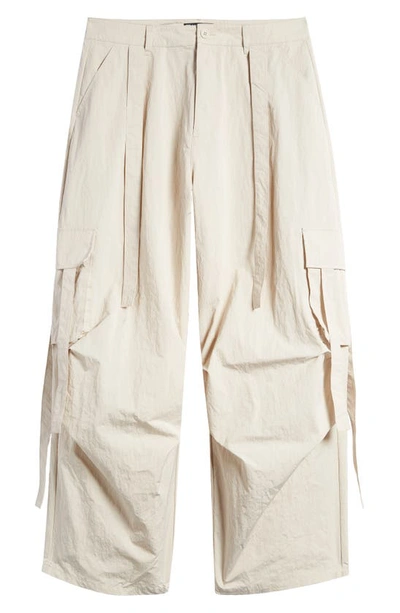 Shop Asos Design Crinkle Nylon Cargo Pants In Cream