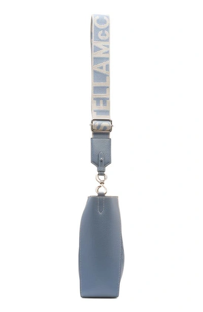 Shop Stella Mccartney Perforated Logo Mini Faux Leather Crossbody Bag In Blue Grey