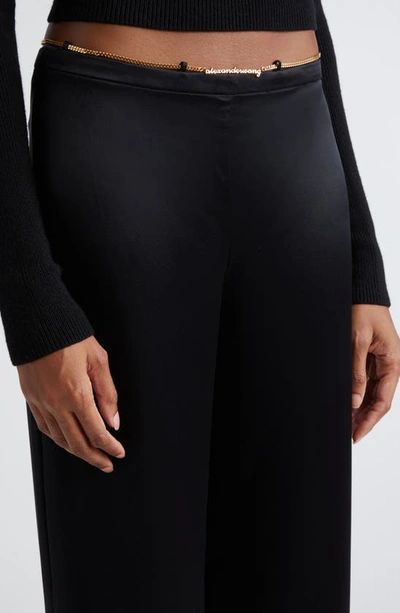 Shop Alexander Wang Logo Hardware Flare Silk Charmeuse Pants In Black