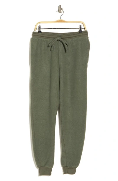 Shop Bella+canvas Faux Suede Joggers In Military Green