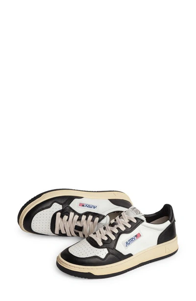 Shop Autry Medalist Low Sneaker In White/ Black