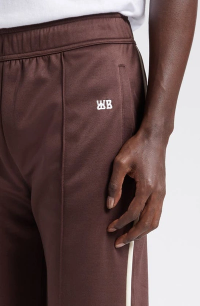 Shop Wales Bonner Kola Embroidered Logo Track Pants In Brown And Ivory