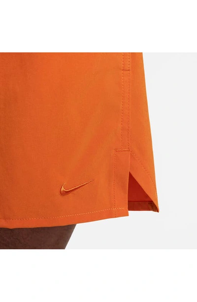 Shop Nike Dri-fit Unlimited 7-inch Unlined Athletic Shorts In Campfire Orange
