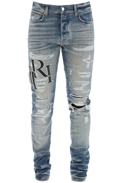 Shop Amiri Destroyed Jeans With Staggered Logo Men In Blue
