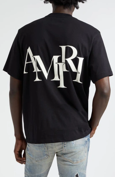Shop Amiri Staggered Logo Cotton Graphic T-shirt In Black