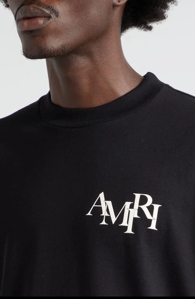Shop Amiri Staggered Logo Cotton Graphic T-shirt In Black