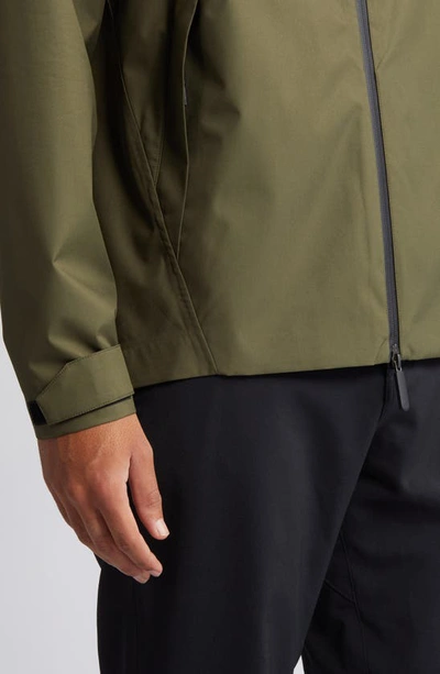 Shop Zella Commuter Waterproof Hooded Jacket In Olive Night