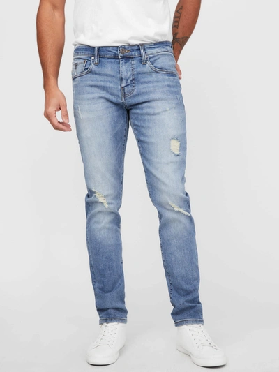 Shop Guess Factory Halsted Tapered Jeans In Blue
