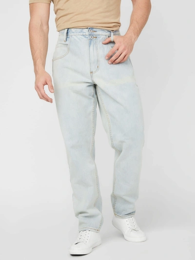 Shop Guess Factory Pascal Relaxed Tapered Jeans In Blue