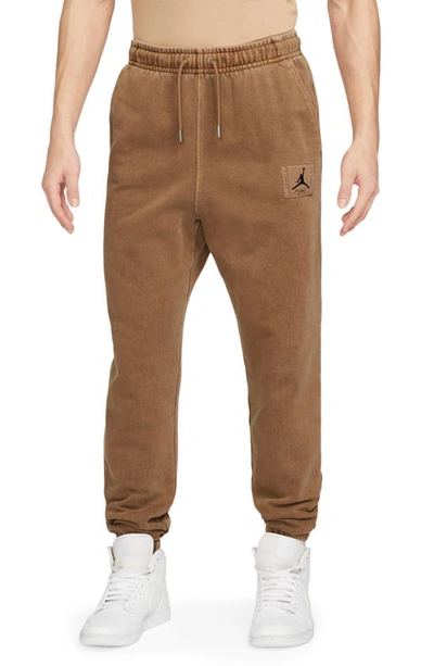 Shop Jordan Flight Essentials Washed Cotton Fleece Sweatpants In Light British Tan