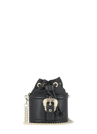 Shop Versace Jeans Couture Logo Engraved Buckled Bucket Bag In Black