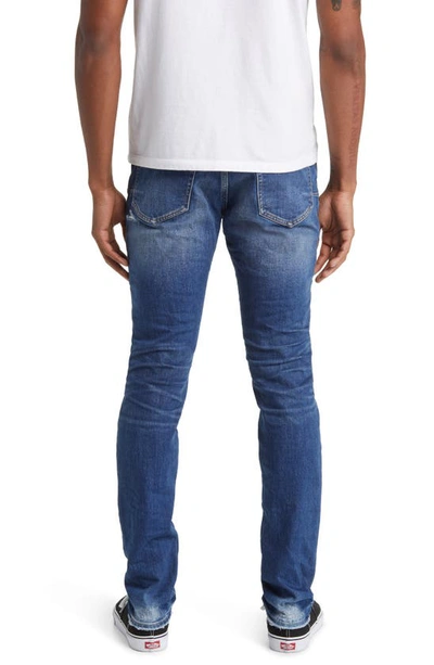 Shop Purple Brand One Year Worn Distressed Skinny Jeans In Dark Indigo