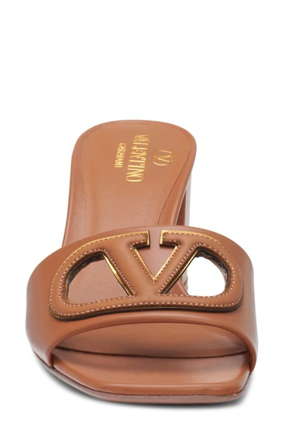 Shop Valentino Vlogo Cutout Slide Sandal In Almond Beige/ Antique Brass