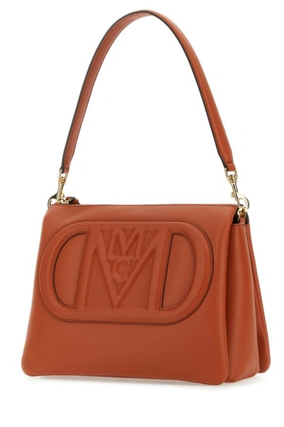 Shop Mcm Unisex Brick Leather Mode Travia Medium Shoulder Bag In Orange
