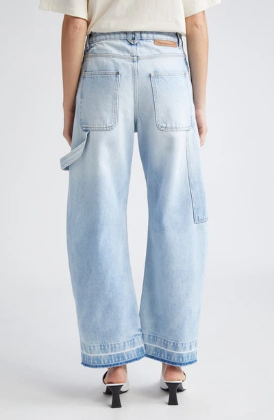 Shop Stella Mccartney High Waist Raw Released Hem Banana Leg Utility Jeans In 4699 - Light Vintage Blue