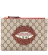 GUCCI GG Supreme embellished coated canvas pouch