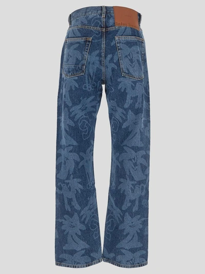 Shop Palm Angels Palm Motif Jeans In Blue Light