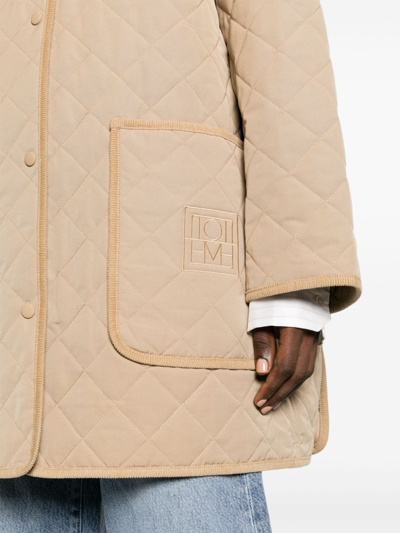Shop Totême Oversizied Quilted Jacket In Beige