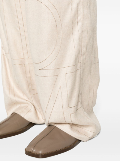 Shop Totême Monogram Flannel Trousers In Beige