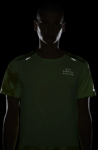 Shop Nike Dri-fit Run Division Rise Running T-shirt In Ghost Green