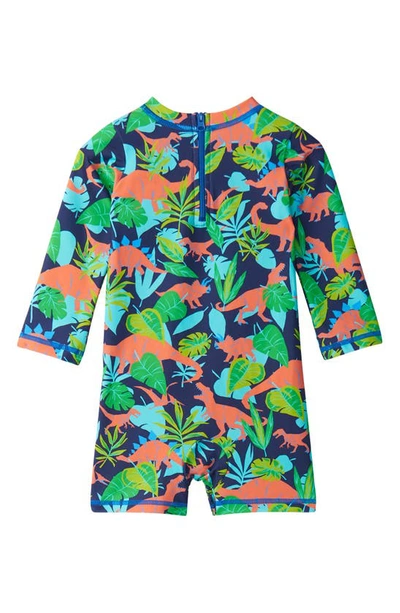 Shop Hatley Dino Jungle Long Sleeve One-piece Rashguard Swimsuit In Blue