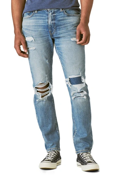Shop Lucky Brand 411 Athletic Ripped Tapered Leg Jeans In Wagener