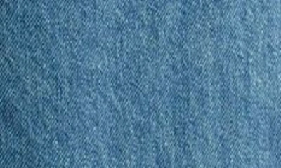 Shop Asos Design Curve Denim Parachute Pants In Mid Blue