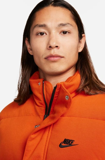 Shop Nike Oversize Therma-fit Down Puffer Jacket In Campfire Orange/ Black