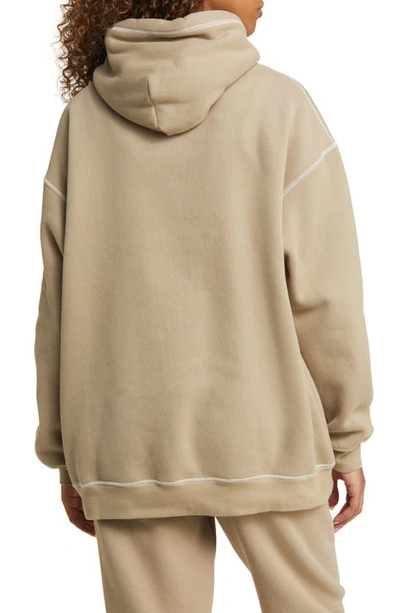 Shop The Mayfair Group Empathy Embroidered Graphic Hoodie In Tan