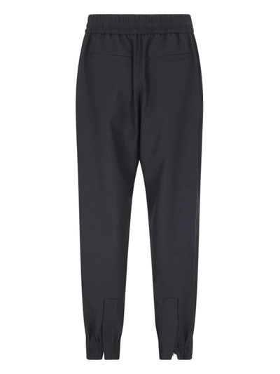 Shop Alexander Mcqueen Trousers In Black