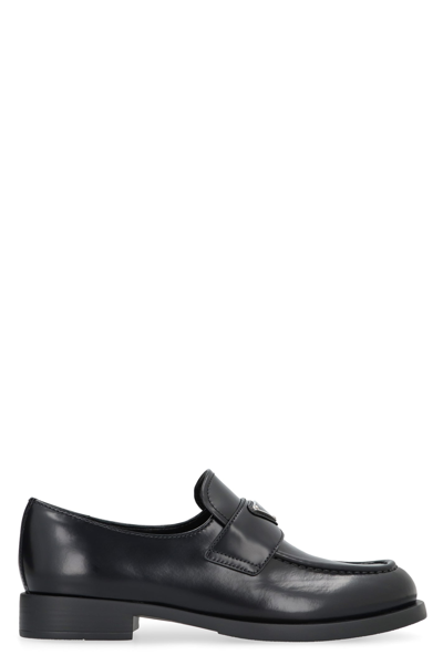 Shop Prada Leather Loafers In Black