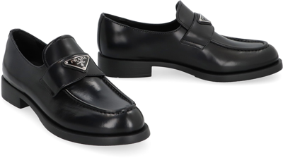 Shop Prada Leather Loafers In Black