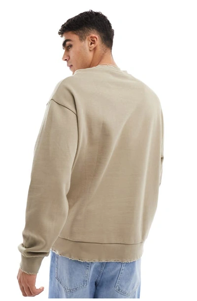 Shop Asos Design Raw Edge Oversize Sweatshirt In Beige
