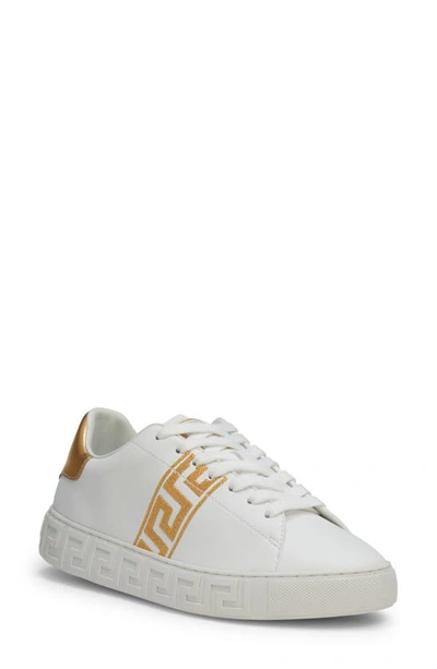 Shop Versace Low Top Sneaker In White/ Gold