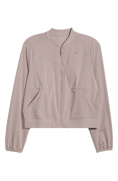 Shop Nike Dri-fit Bliss Bomber Jacket In Diffused Taupe/ Clear